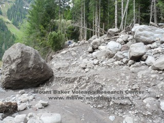 This 14' high boulder was deposited by the 5/31 flow. Photo taken 6/5. Compare with next photo.